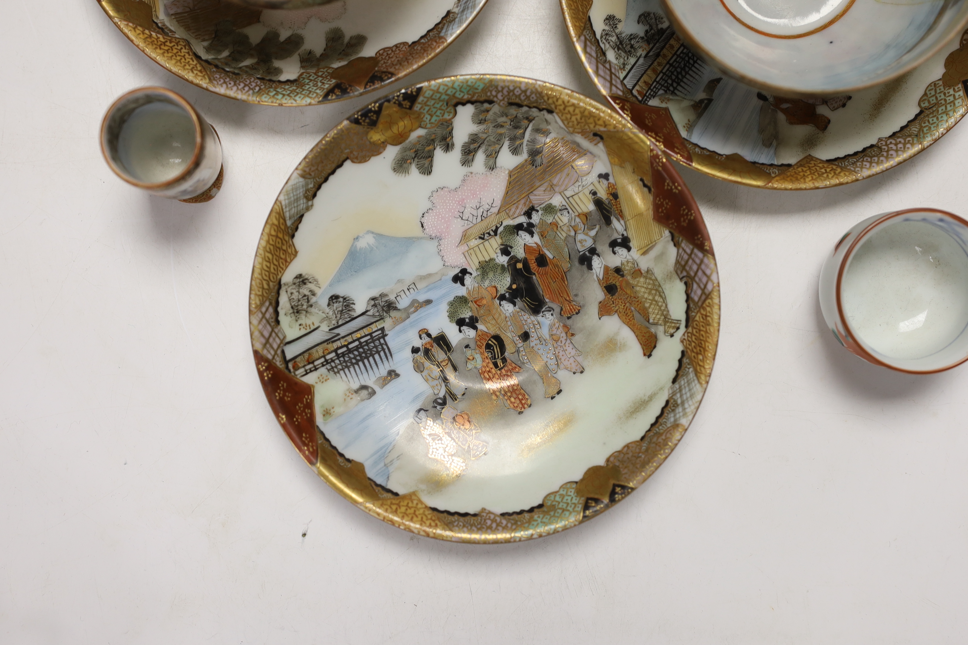 Japanese ceramics including an Imari bottle vase, a Satsuma vase and Kutani eggshell porcelain, tallest 22cm (8)